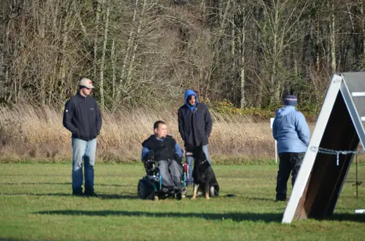 Jason Lake working a black German Shepherd during obedience at the 2012 Cascade Schutzhund trial — photo 03