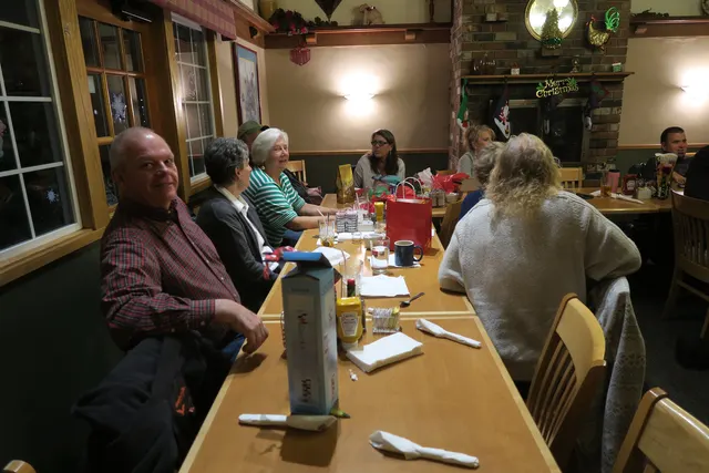 2016 Club Christmas Party on December 17, 2016 — club members visiting across the dinner table — photo 08