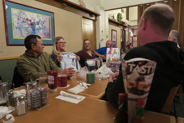 2016 Club Christmas Party on December 17, 2016 — members sharing conversation during the holiday dinner — photo 13
