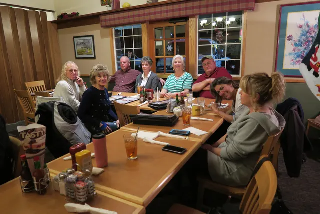 2016 Club Christmas Party on December 17, 2016 — club members talking together over dinner — photo 03
