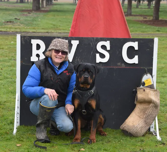 March 22, 2014 RVSC Club Training — a club member posing with a working dog at the RVSC field — photo 01