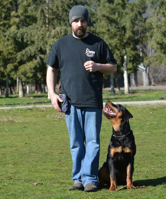 March 22, 2014 RVSC Club Training — a club member posing with a working dog at the RVSC field — photo 11