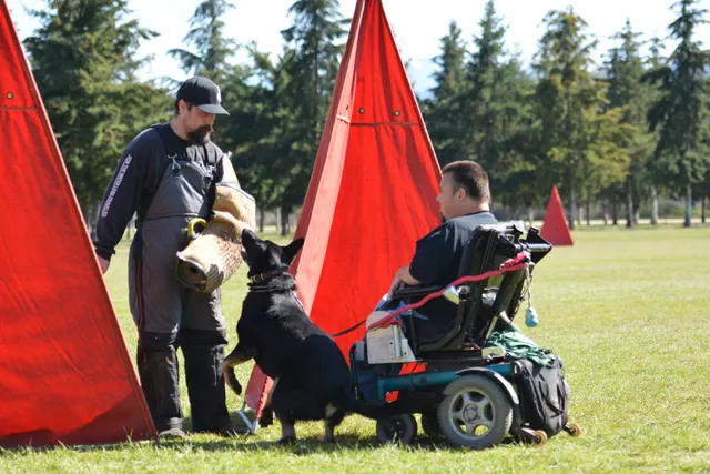 March 22, 2014 RVSC Club Training — a club member posing with a working dog at the RVSC field — photo 26