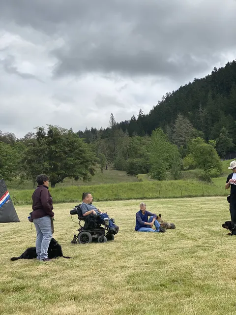 May 1, 2021 Club Training — club members observing a dog-and-handler team on the field — photo 02
