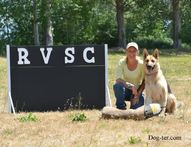 May 31, 2014 RVSC Club Training — a handler posing with a working dog at the RVSC field — photo 01