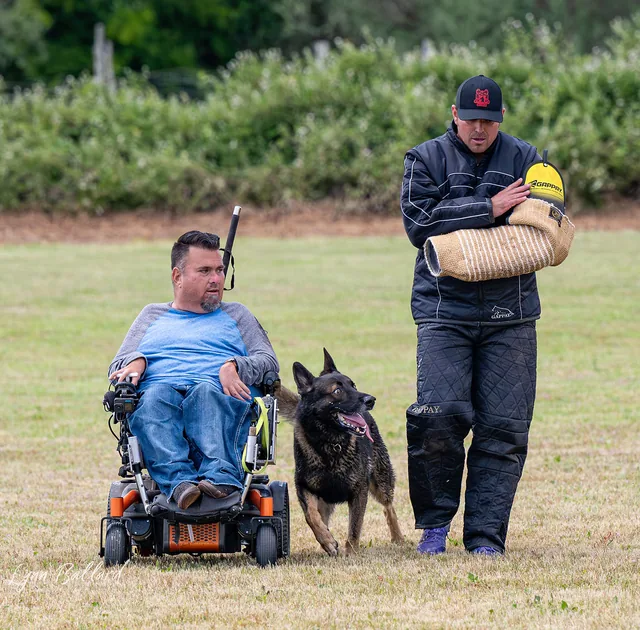 RVSC IGP & RH Trial — May 16–17, 2026 — wheelchair handler, helper and working dog together on the trial field — photo 08